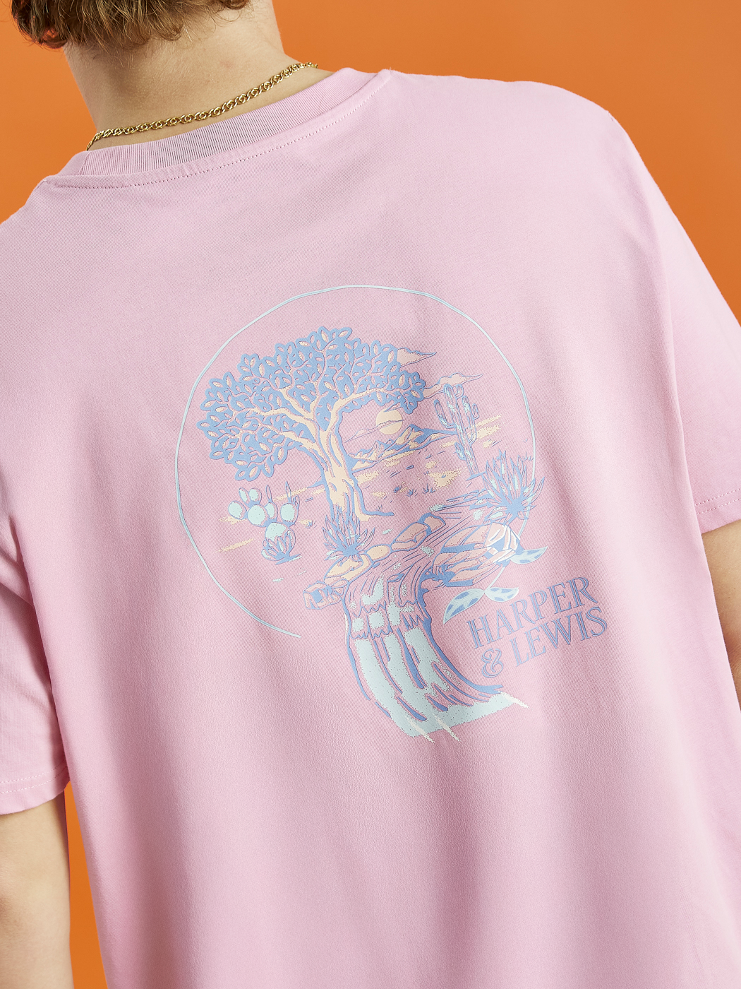 Back graphic of the Aura tee, showing colours of blue, peach and lavender.