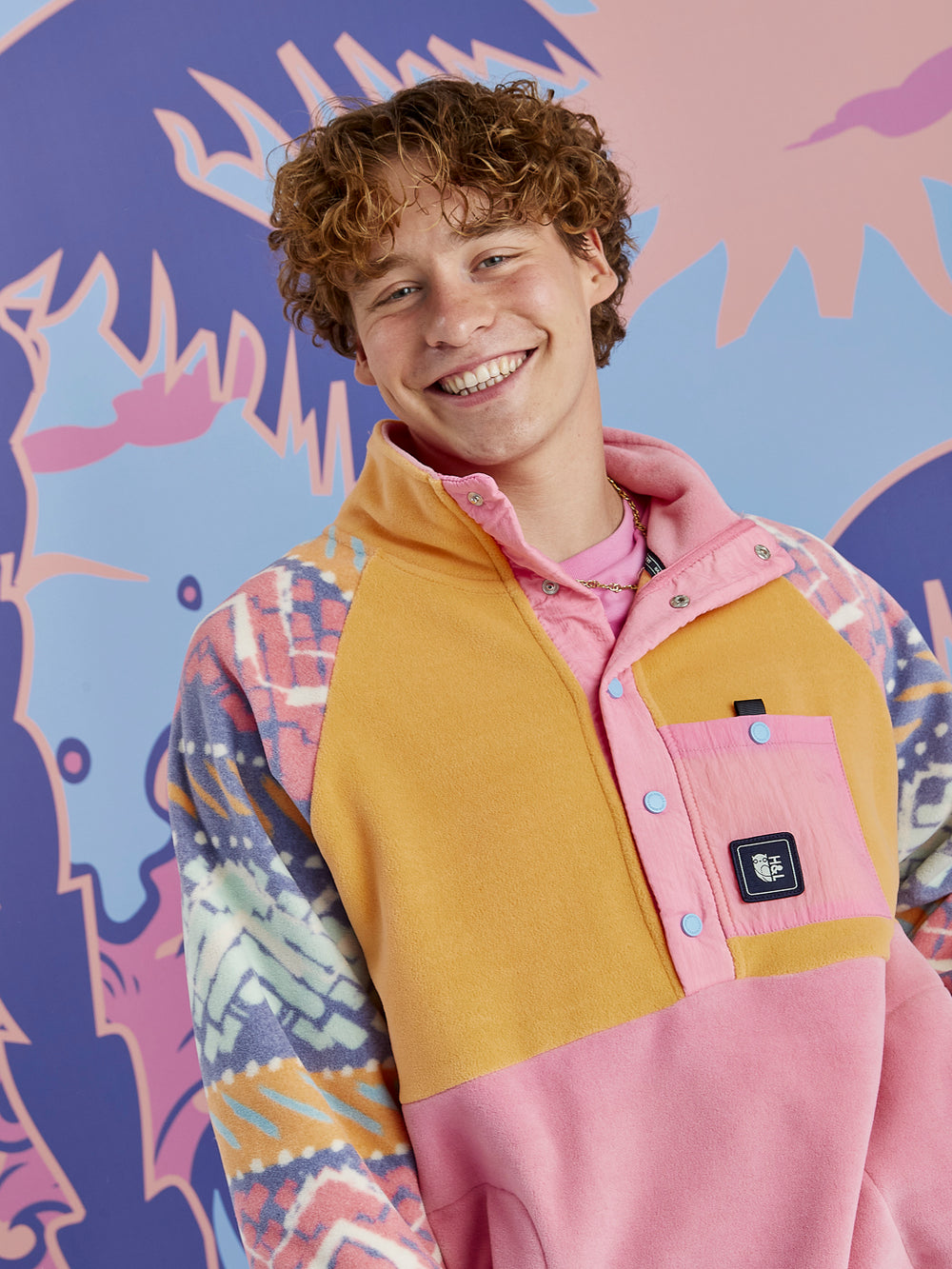 Model wearing the Sutton Retro Fleece with relaxed 90s-inspired styling, showcasing the oversized fit and geometric pastel pattern.