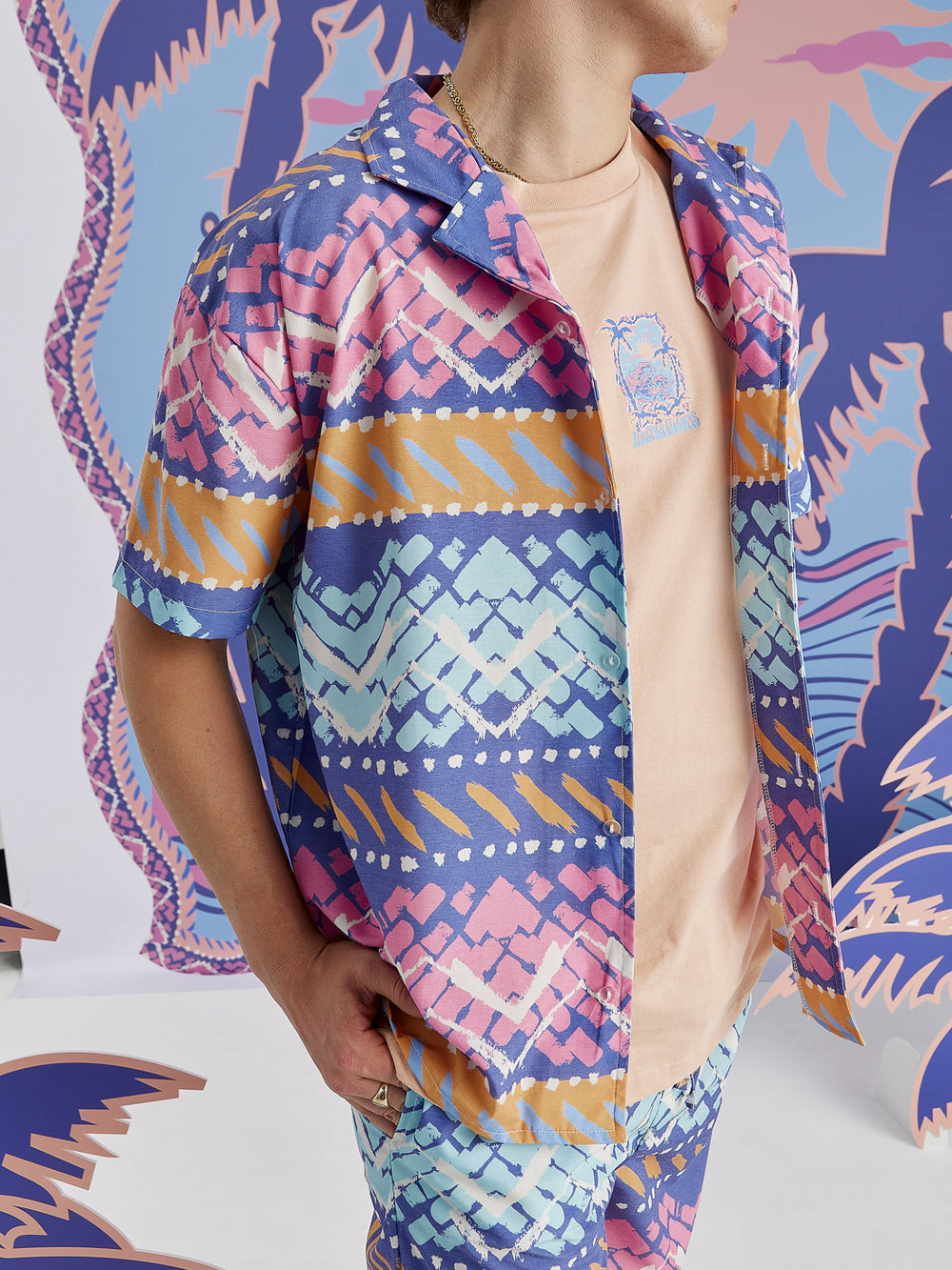 Male Model wearing the Unisex shirt styled open with a t-shirt underneath.