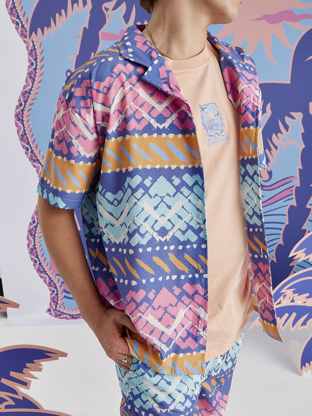 Male Model wearing the Unisex shirt styled open with a t-shirt underneath.