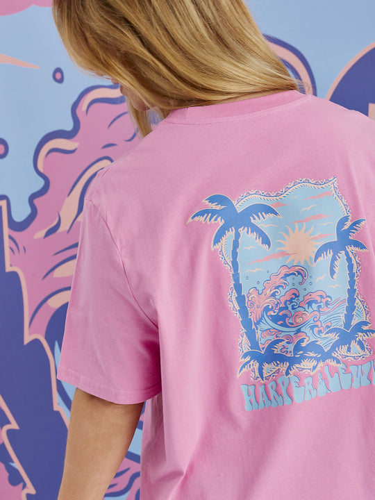 Detail shot of the back Tropical graphic on the Alwan tee in Pink.