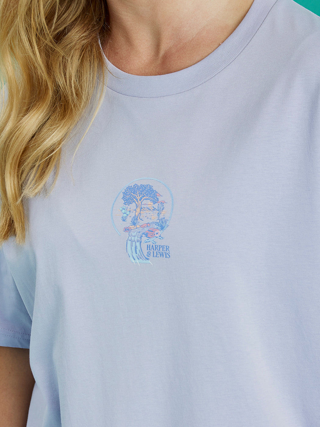 Front detail shot of the Lavender Aura tee, this shows the graphic which is the tree of life in blue, lavender and peach.