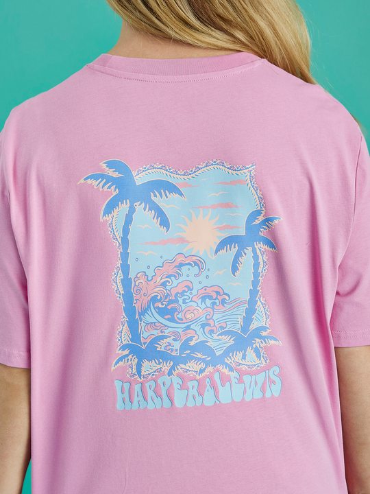 Detail shot of the back Tropical graphic on the Alwan tee in Pink.