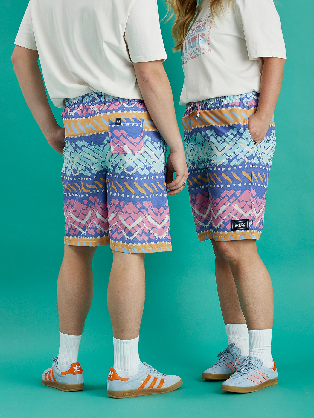 Both models wearing the Cove Shorts, this shows the front and the back of these shorts with the back pocket showing.