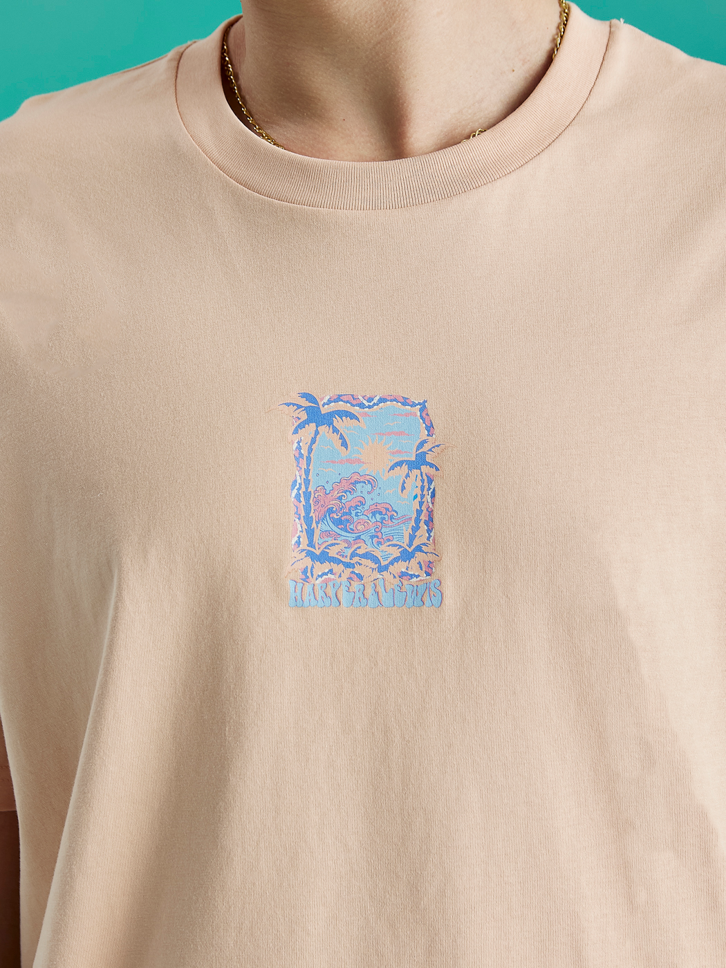 The front graphic features palm trees and a sunset with waves.
