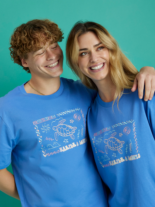 Male & Female Model both wearing the Surya t-shirt in Royal Blue, this tee features an abstract H&L spell out design.