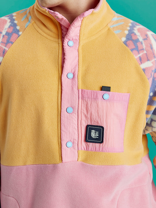 Close-up of Sutton fleece collar and popper placket, with pink contrast detail and soft fleece texture.