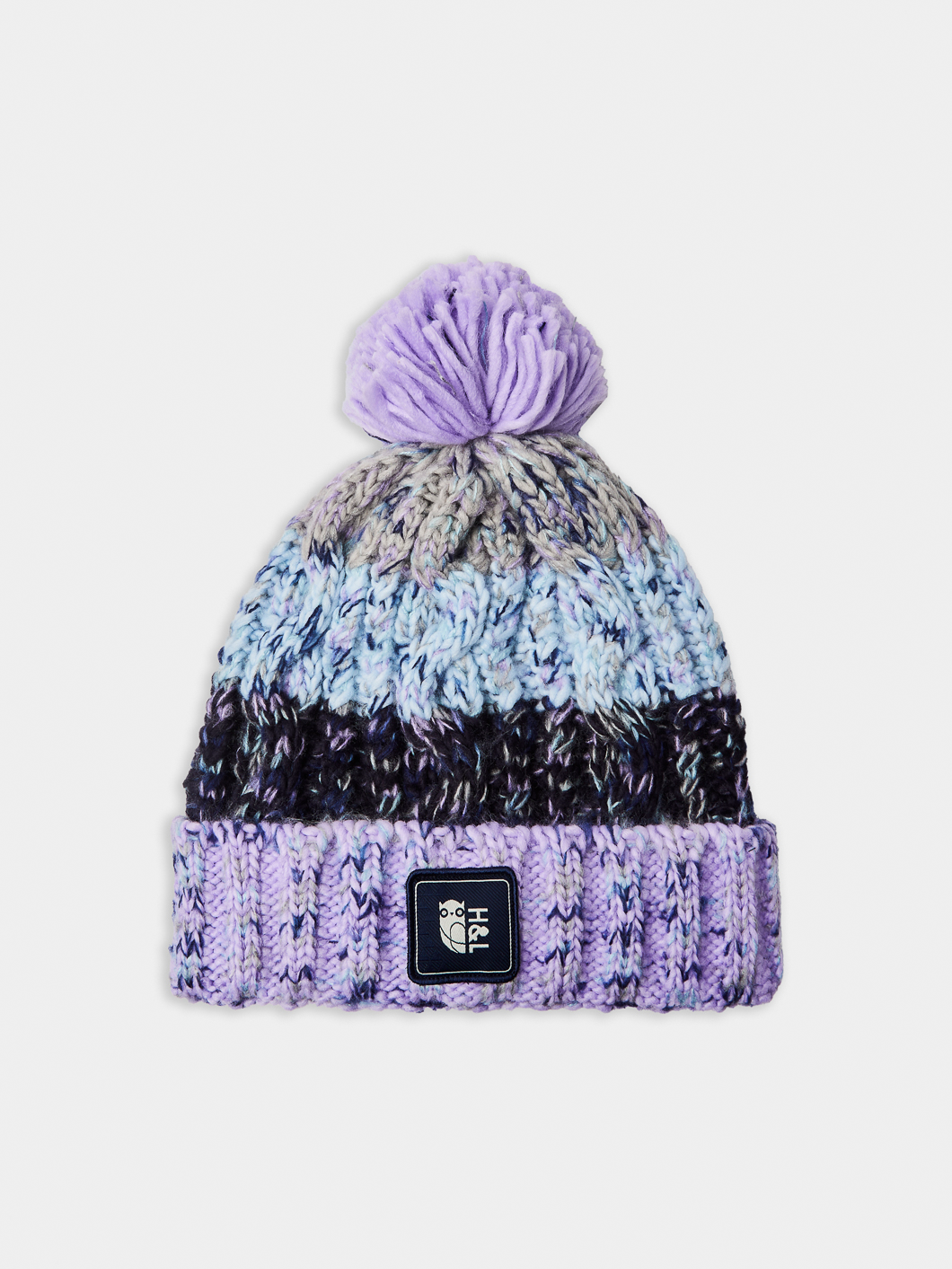 This heavyweight multi-yarn cable knit beanie is designed for both warmth and style.