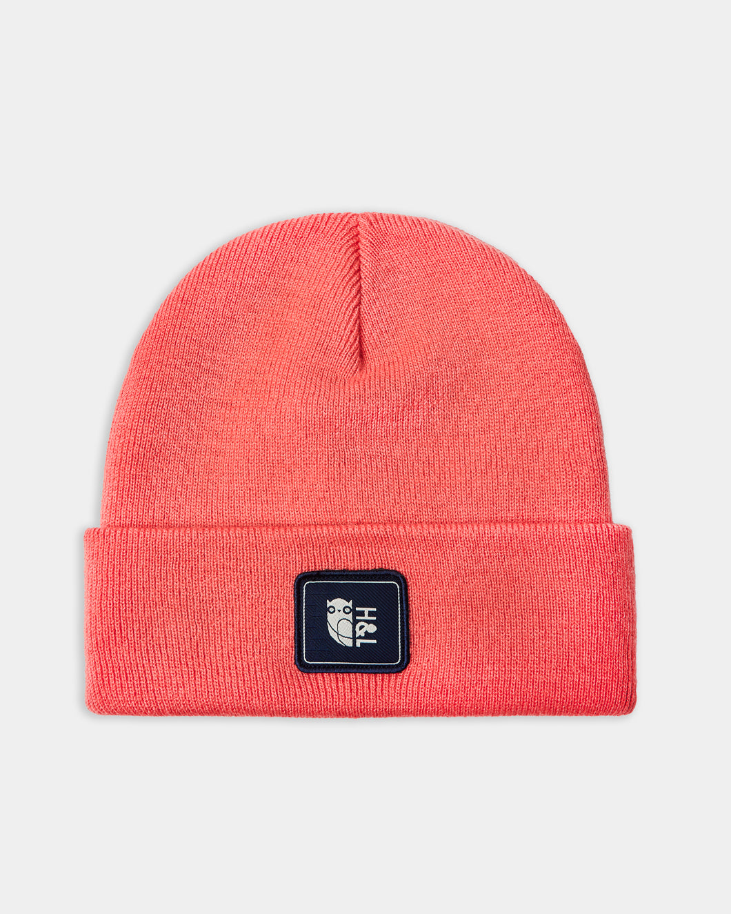 A cosy turn-up beanie in a Coral shade, made from 100% acrylic.
