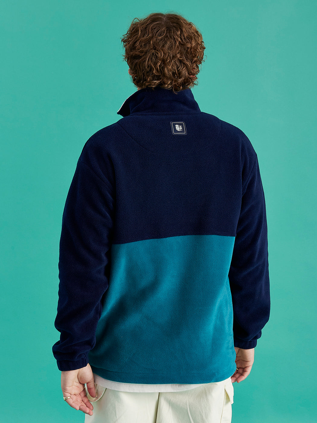 Quarter zip with Navy branded zip pull, with cream embroidered Harper & Lewis Logo, adding subtle details to warm fleece.
