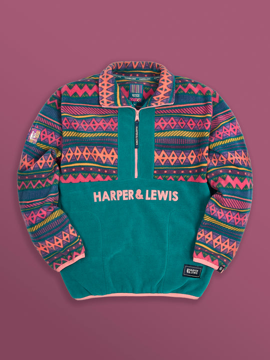 Flatlay image of the ztec and teal fleece, this shows the zip pulled down to show the pattern in the collar.