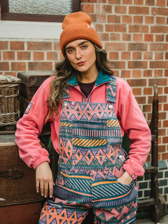 Detail shot of the front bib of the retro pattern dungarees 