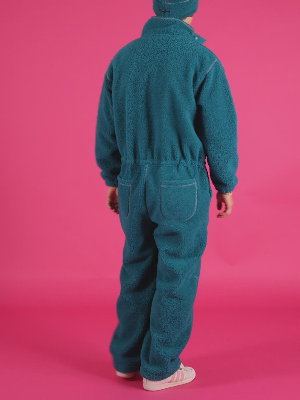 Crafted from 100% polyester sherpa fleece, this jumpsuit is designed for warmth, comfort, and style.