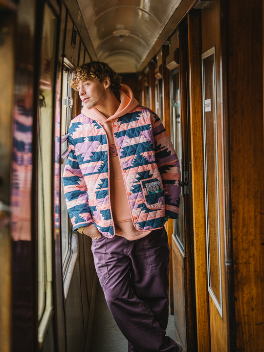 Inspired by traditional liner jackets, it features our retro Tribal Pattern Peach